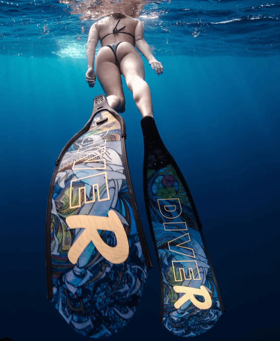 Person underwater wearing a swimsuit and fins with 'DIVER' branding.